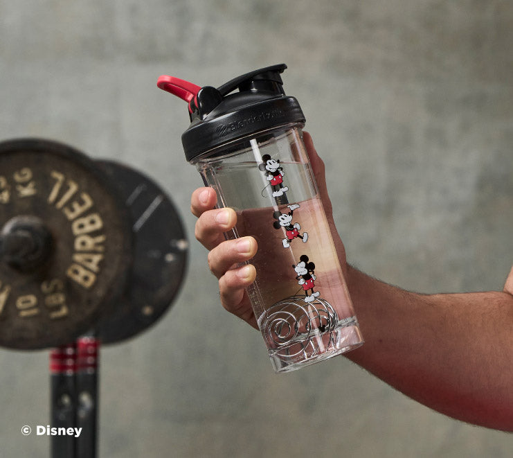 pro-series-l6 Mickey_Mouse_Protein_Shaker_Bottle_Being_Held_In_the_Gym.jpg